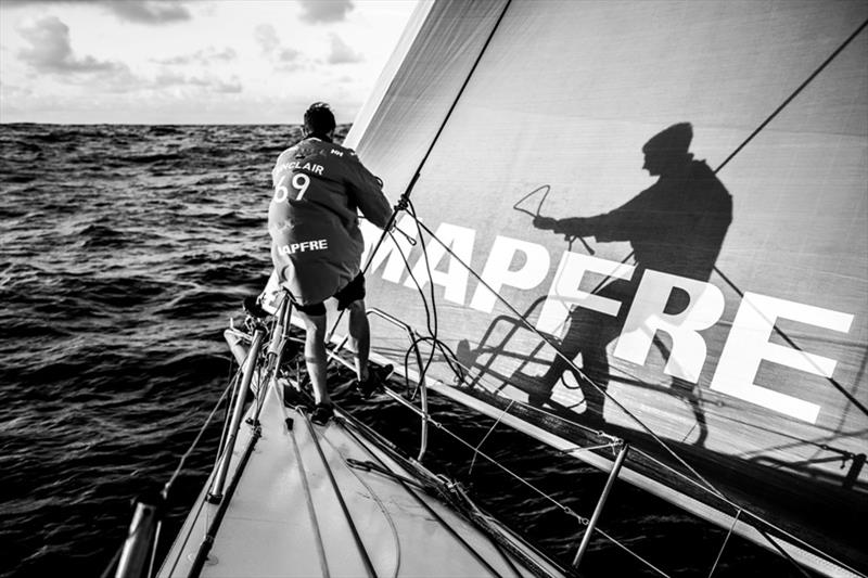 Volvo Ocean Race Leg 6 to Auckland, day 18 on board MAPFRE, sunrise, Louis Sinclair with his shadow at the bow during a pilling. 24 February photo copyright Ugo Fonolla / Volvo Ocean Race taken at  and featuring the Volvo One-Design class