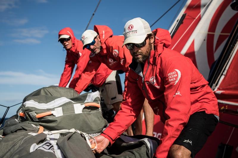 Volvo Ocean Race Leg 6 to Auckland, day 20 on board Dongfeng. Stacking the sail for Daryl Wislang and his team mates. 26 February photo copyright Martin Keruzore / Volvo Ocean Race taken at  and featuring the Volvo One-Design class