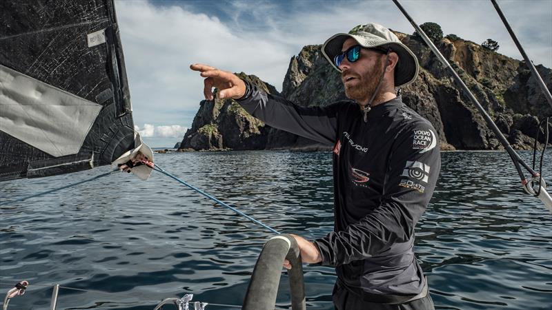 Leg 6 to Auckland, Day 20 on board Sun hung Kai / Scallywag. Marcus Ashley-Jones helming while we're passing the coast line close to the rocks. 27 February, . - photo © Jeremie Lecaudey / Volvo Ocean Race