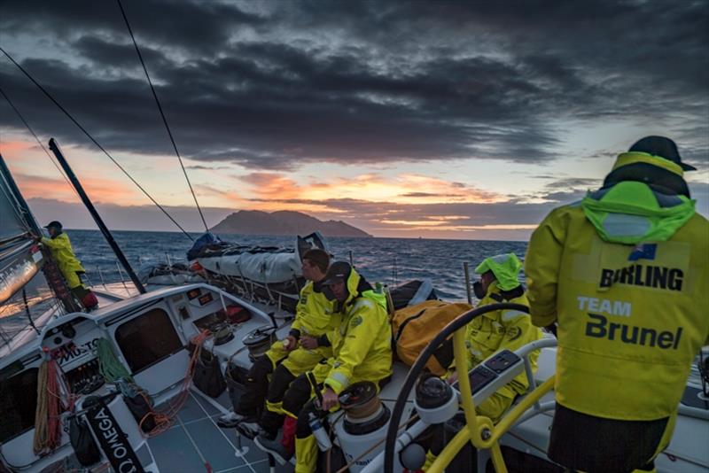 Volvo Ocean Race Leg 7 from Auckland to Itajai, day 01 on board Brunel. Passing White island at sunrise. Peter Burling. Carlo Huisman. Abby Ehler at the mast. Not sure about the other ones - photo © Yann Riou / Volvo Ocean Race