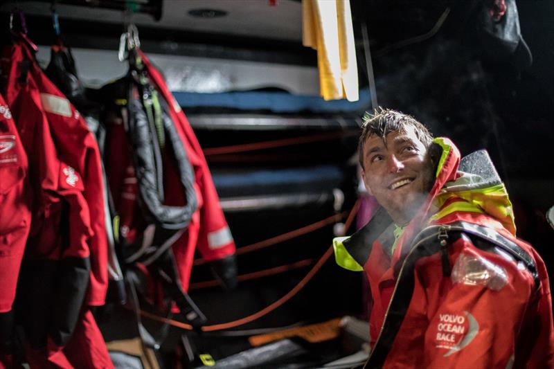 Leg 7 from Auckland to Itajai, day 6 on board Sun Hung Kai / Scallywag. Alex Gough sharing a smile abd warming up down below. 24 March,  photo copyright Konrad Frost / Volvo Ocean Race taken at  and featuring the Volvo One-Design class