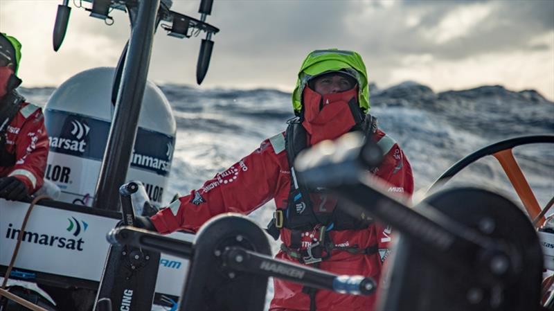Volvo Ocean Race Leg 7 from Auckland to Itajai, day 08 on board Vestas 11th Hour. Satcey Jackson waiting to grind under the cold, appreciates this rare moment of sunshine photo copyright Jeremie Lecaudey / Volvo Ocean Race taken at  and featuring the Volvo One-Design class