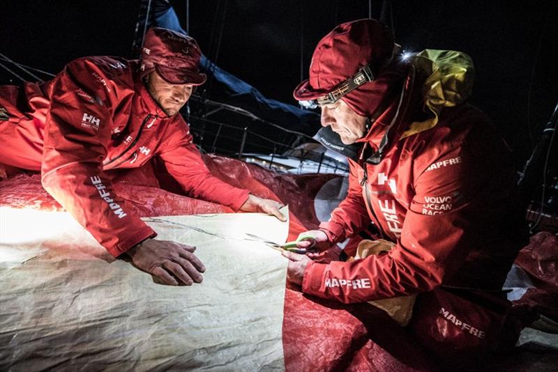 Volvo Ocean Race Leg 7 from Auckland to Itajai, day 13 on board MAPFRE, Santi and Blair cutting a piece of 3Di for the mainsail - photo © Ugo Fonolla / Volvo Ocean Race