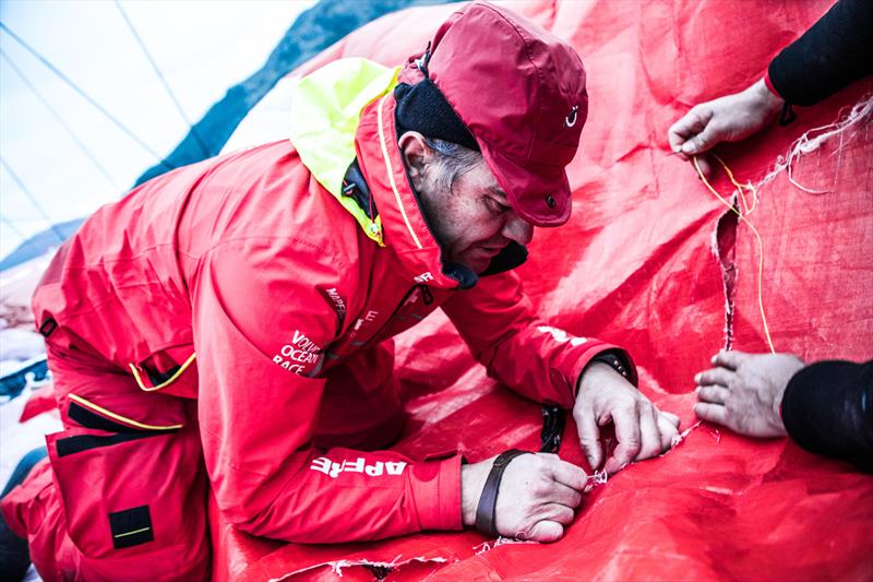 Leg 7 from Auckland to Itajai, day 12 on board MAPFRE, Santi stitching the main sail, 29 March,  photo copyright Ugo Fonolla / Volvo Ocean Race taken at  and featuring the Volvo One-Design class