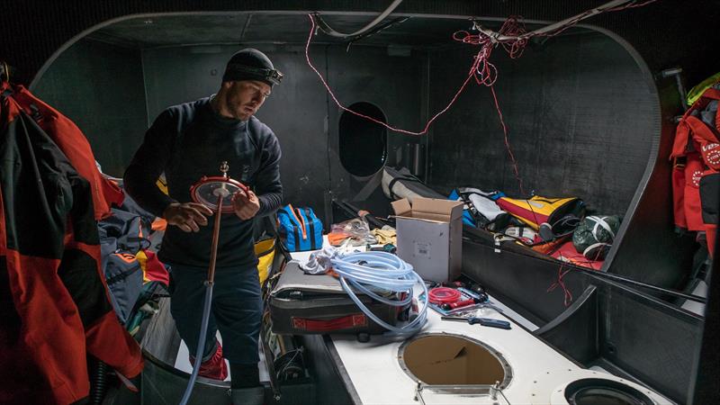 Simon Fisher holding a temporary fuel pipe used to access the bow trim tank - Vestas 11th Hour Racing, Port Stanley, Falkland Islands - photo © Jeremie Lecaudey / Volvo Ocean Race