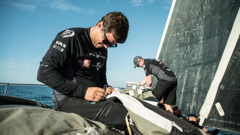 Volvo Ocean Race Leg 8 Itajai To Newport, Fontes fixing a bag on the foredeck, Day 1 on board Sun Hung Kai / Scallywag photo copyright Rich Edwards / Volvo Ocean Race taken at  and featuring the Volvo One-Design class