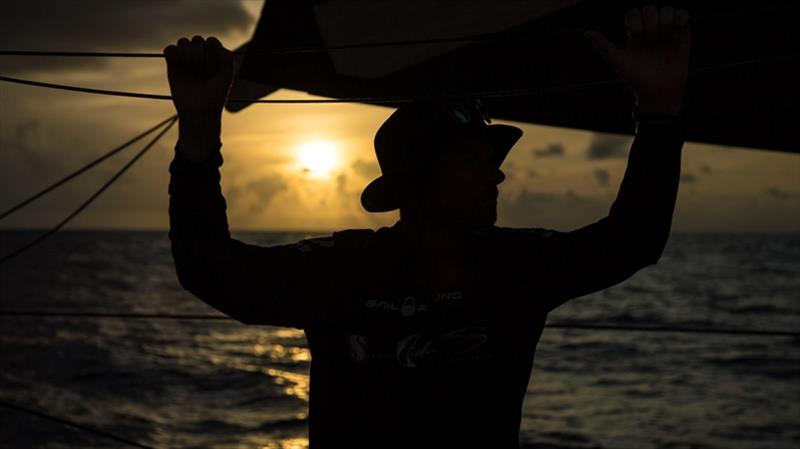Volvo Ocean Race Leg 8 from Itajai to Newport, day 07, on board Sun Hung Kai / Scallywag. Peter Cumming reflective in the cockpit. Peter Cumming backlit at dusk photo copyright Rich Edwards / Volvo Ocean Race taken at  and featuring the Volvo One-Design class