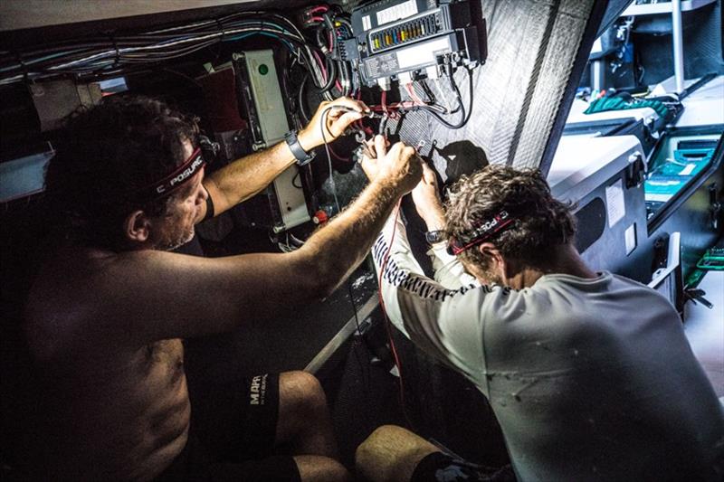 Volvo Ocean Race Leg 8 from Itajai to Newport, day 07, on board MAPFRE, Joan Vila and Antonio Cuervas-Mons checking whether any other electronic devices of the boat have been damaged. - photo © Ugo Fonolla / Volvo Ocean Race
