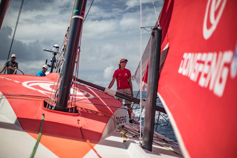 Leg 8 from Itajai to Newport, day 09 on board Dongfeng. 30 April, . Light wind day crossing the equator, Carolijn checking the jib photo copyright Jeremie Lecaudey / Volvo Ocean Race taken at  and featuring the Volvo One-Design class