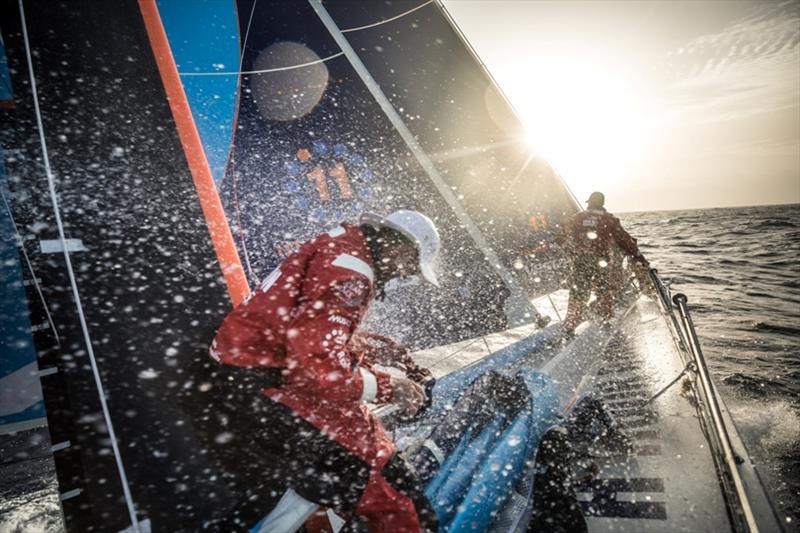 Volvo Ocean Race Leg 8 from Itajai to Newport, day 10, on board Vestas 11th Hour. Greaty action at the bow at the sunset during a peeling. - photo © Martin Keruzore / Volvo Ocean Race