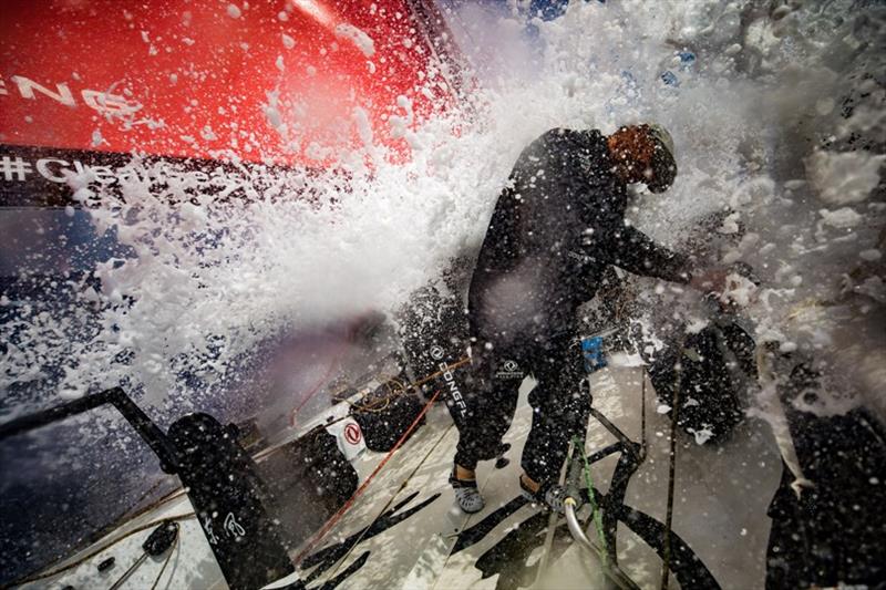 Volvo Ocean Race Leg 8 from Itajai to Newport, day 10, on board Dongfeng. Stu Bannatyne under splashes. - photo © Jeremie Lecaudey / Volvo Ocean Race