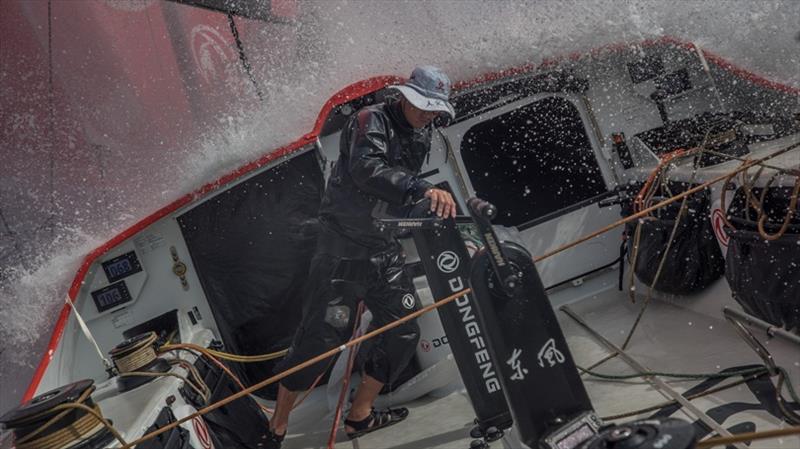 Volvo Ocean Race Leg 8 from Itajai to Newport, day 11, on board Dongfeng. Horace working at the pit under splashes photo copyright Jeremie Lecaudey / Volvo Ocean Race taken at  and featuring the Volvo One-Design class