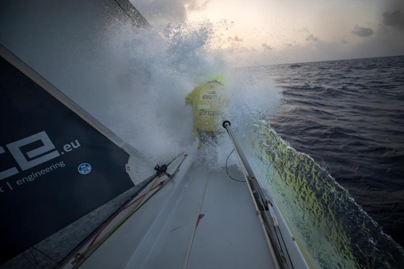 Volvo Ocean Race Leg 8 from Itajai to Newport, day 10, on board Brunel. Nina Curtis cleans weeds from the bow photo copyright Sam Greenfield / Volvo Ocean Race taken at  and featuring the Volvo One-Design class