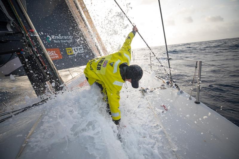 Volvo Ocean Race Leg 8 from Itajai to Newport, day 11, on board Brunel. Abby Ehler on the bow cleaning Sargassum weeds. - photo © Sam Greenfield / Volvo Ocean Race