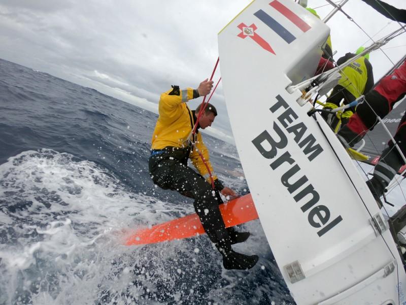 Volvo Ocean Race Leg 9, from Newport to Cardiff, day 3, on board Brunel. Kyle Langford sanding down rudder damage photo copyright Sam Greenfield / Volvo Ocean Race taken at  and featuring the Volvo One-Design class