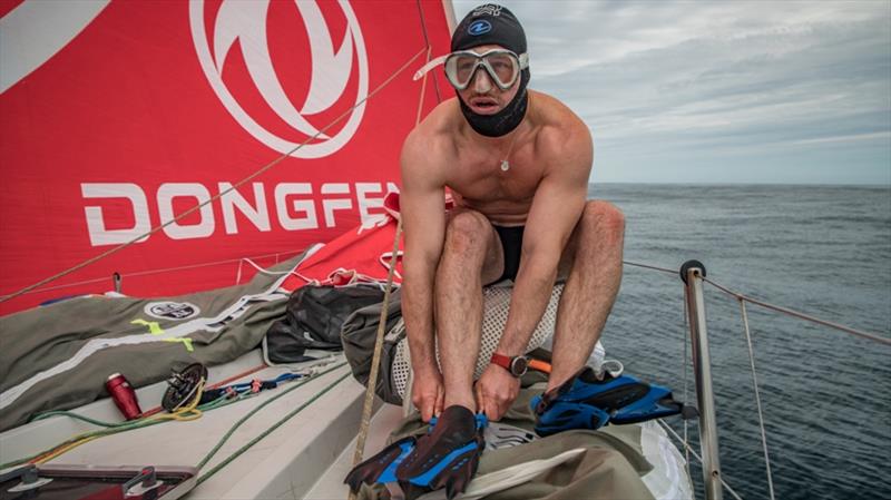 Volvo Ocean Race Leg 9, from Newport to Cardiff, day 07, on board Dongfeng. Kevin Escoffier ready to jump in 15 dergres water to get some sea grass out of the quille photo copyright Jeremie Lecaudey / Volvo Ocean Race taken at  and featuring the Volvo One-Design class