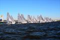 The fleet of 34 VX One's push the line for the first of two general recalls while trying to start Race 7 of the Winter Series #3 regatta hosted by Pensacola YC on Pensacola Bay. © Talbot Wilson