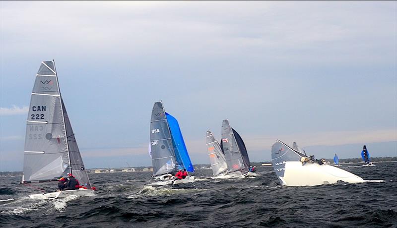 Sarah Alexander, Katja Sertl and Mariah LeffingwellIn are about to take a swim in Pensacola Bay after their capsize on Pensacola Bay on the first downwind leg of Race #1 of the VX One Midwinter Championship photo copyright Talbot Wilson taken at Pensacola Yacht Club and featuring the VX One class