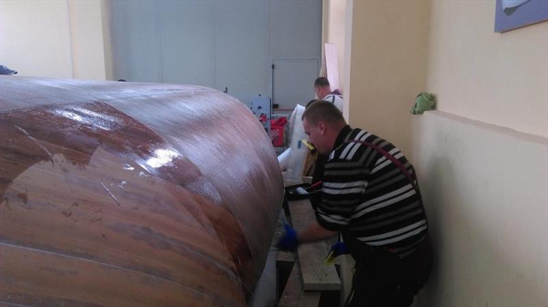 Croatian Gajeta build - the team first roll on a coat of Epoxy onto the bare wooden surface photo copyright Wessex Resins & Adhesives taken at  and featuring the  class
