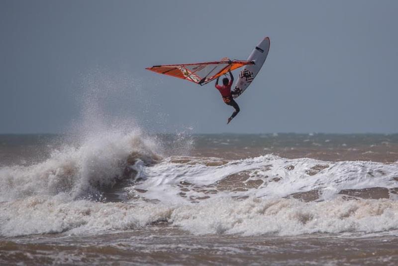 Takara Ishii flying high with one foot out of the strap - photo © Nicolas Jones / IWT