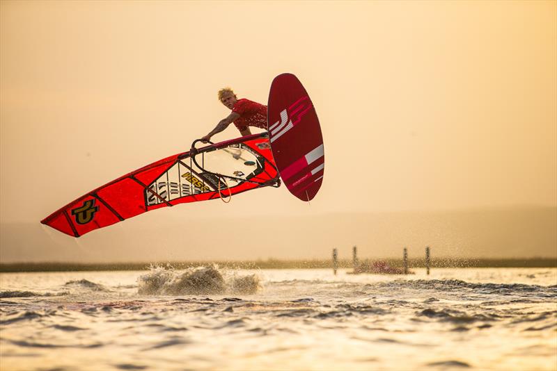 Amado Vrieswijk flying through the sunset on the first weekend - Surf Worldcup 2019 - photo © Martin Reiter / www.reiter-foto.com