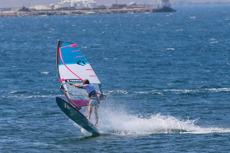 Throw your body forward and get yourself over the sail by pushing it down with the mast hand and sheeting in with the sail hand. - photo © Tricktionary