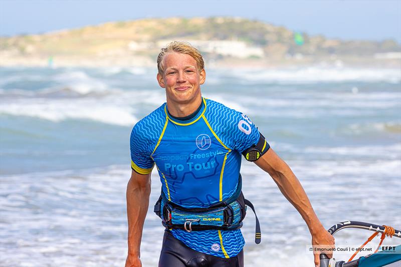 Tim's always running around the beach with a smile! photo copyright Emanuela Cauli taken at  and featuring the Windsurfing class