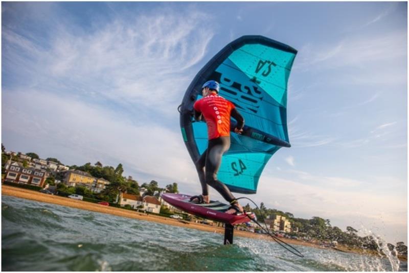 Tom Buggy wing foiling off Cowes July 2021 photo copyright John Carter taken at Island Sailing Club, Cowes and featuring the Wing Foil class