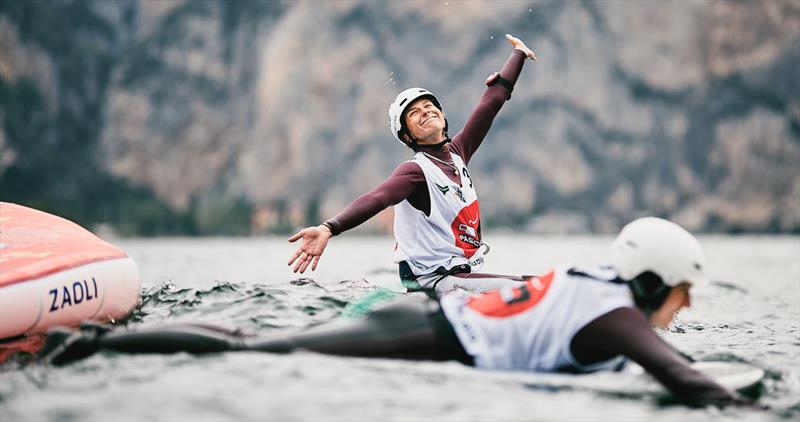 Karolina Kluszczynska goes all 'Swan Lake' as she sinks to the water - 2023 Pascucci WingFoil Racing World Cup Campione del Garda, Day 3 photo copyright IWSA media / Robert Hajduk taken at Campione Univela and featuring the Wing Foil class