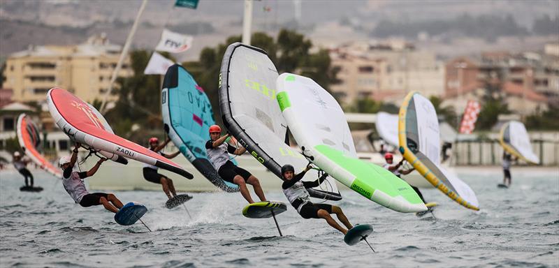 Josh Armit (red helmet) in pursuit of Julien Ratotti (foreground) - 2023 WingFoil Racing World Cup - photo © IWSA media / Robert Hajduk