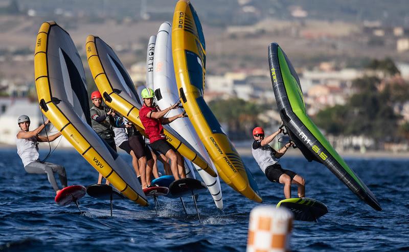 Ghio (red bib) leading the pack in Gold Fleet - 2023 WingFoil Racing World Cup Cagliari - photo © IWSA media / Robert Hajduk