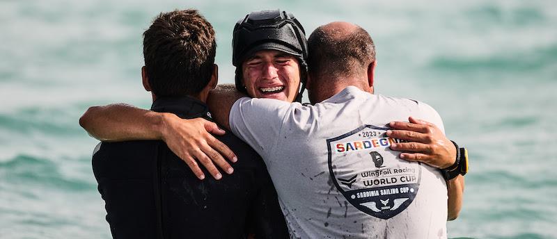 Biggest climber of the day, Ernesto de Amicis, celebrates with family - 2023 WingFoil Racing World Cup photo copyright IWSA media / Robert Hajduk taken at  and featuring the Wing Foil class