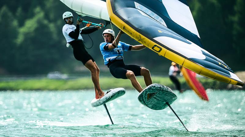Freddie Strawson [GBR] battling Kamil Manowiecki [POL] - Ensis Engedinwing 2025 WingFoil Racing World Cup Switzerland - Day 4 - photo © IWSA media / Robert Hajduk