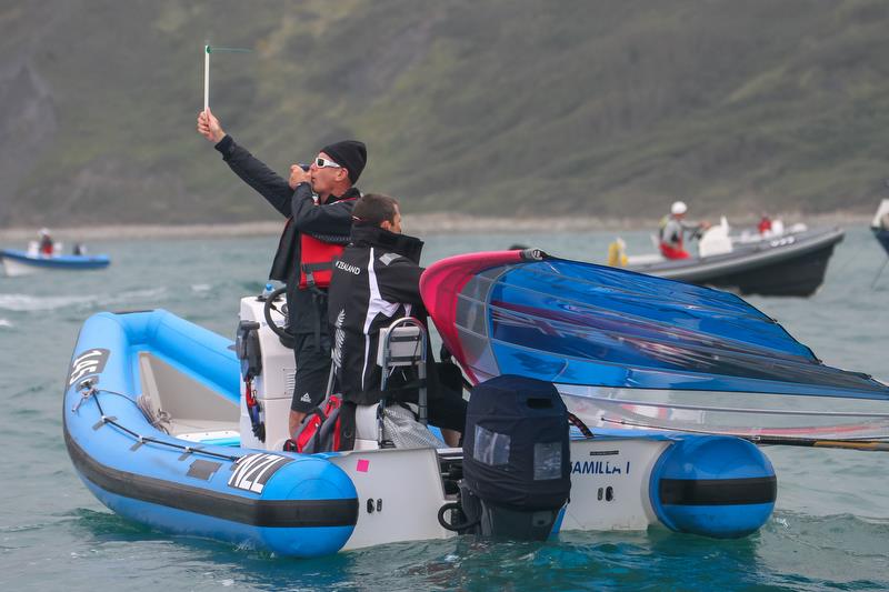 Measuring wind the old way with a ribbon and a handbearing compass - 2012 Olympic Regatta, Weymouth - photo © Richard Gladwell