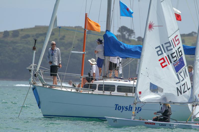 WindBot on the foredeck PRO John Parrish's yacht as checks with his team before a Laser Radial start  in the Oceanbridge NZL Sailing Regatta, February 2019 photo copyright Richard Gladwell taken at  and featuring the  class