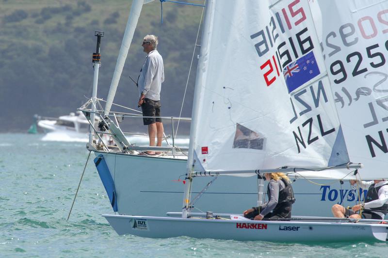 WindBot on the foredeck PRO John Parrish's yacht as checks with his team before a Laser Radial start  in the Oceanbridge NZL Sailing Regatta, February 2019 photo copyright Richard Gladwell taken at  and featuring the  class
